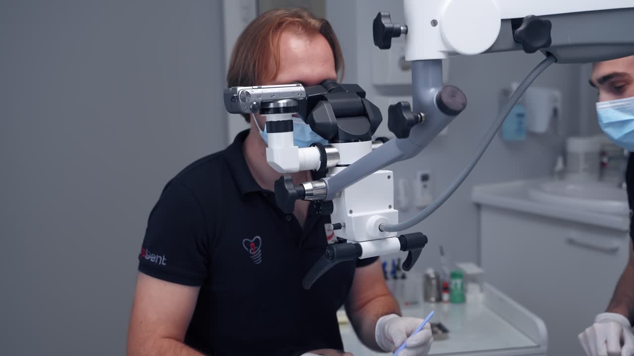 Modern equipment microscope in dental office. Doctor dentist using dental microscope in modern dental office