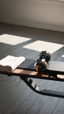 home gym setup with dumbbells and exercise bench