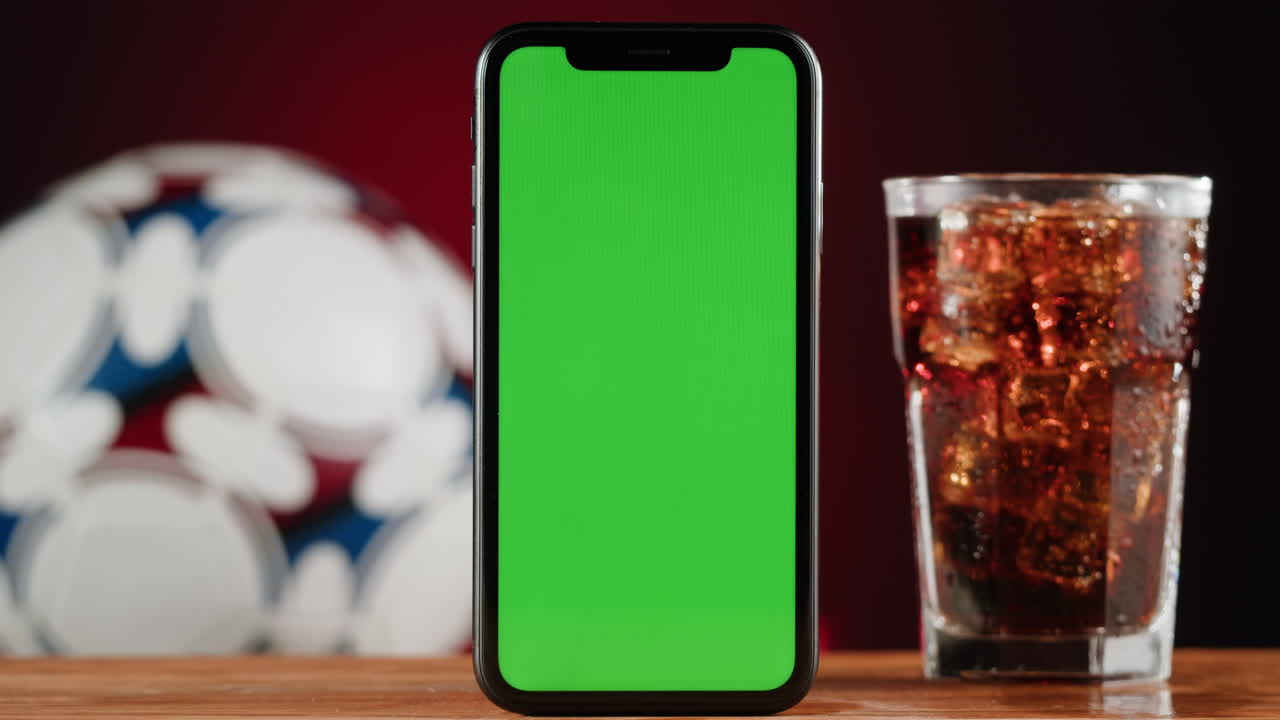 Green Screen Phone with Soccer Ball and Soda
