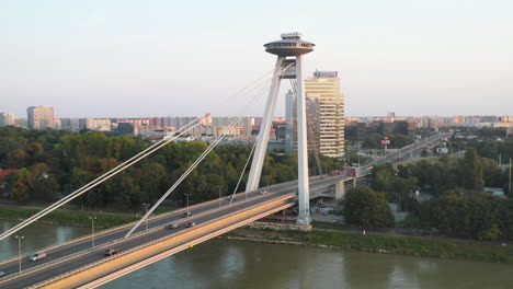 cinematic rotating drone shot of the bridge of the slovak national uprising in bratislava, slovakia