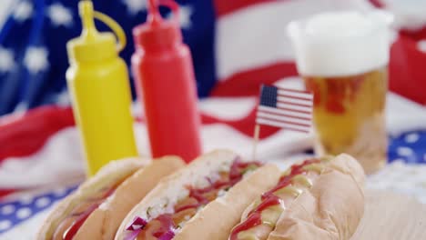 hot dogs served on wooden board with 4th july theme