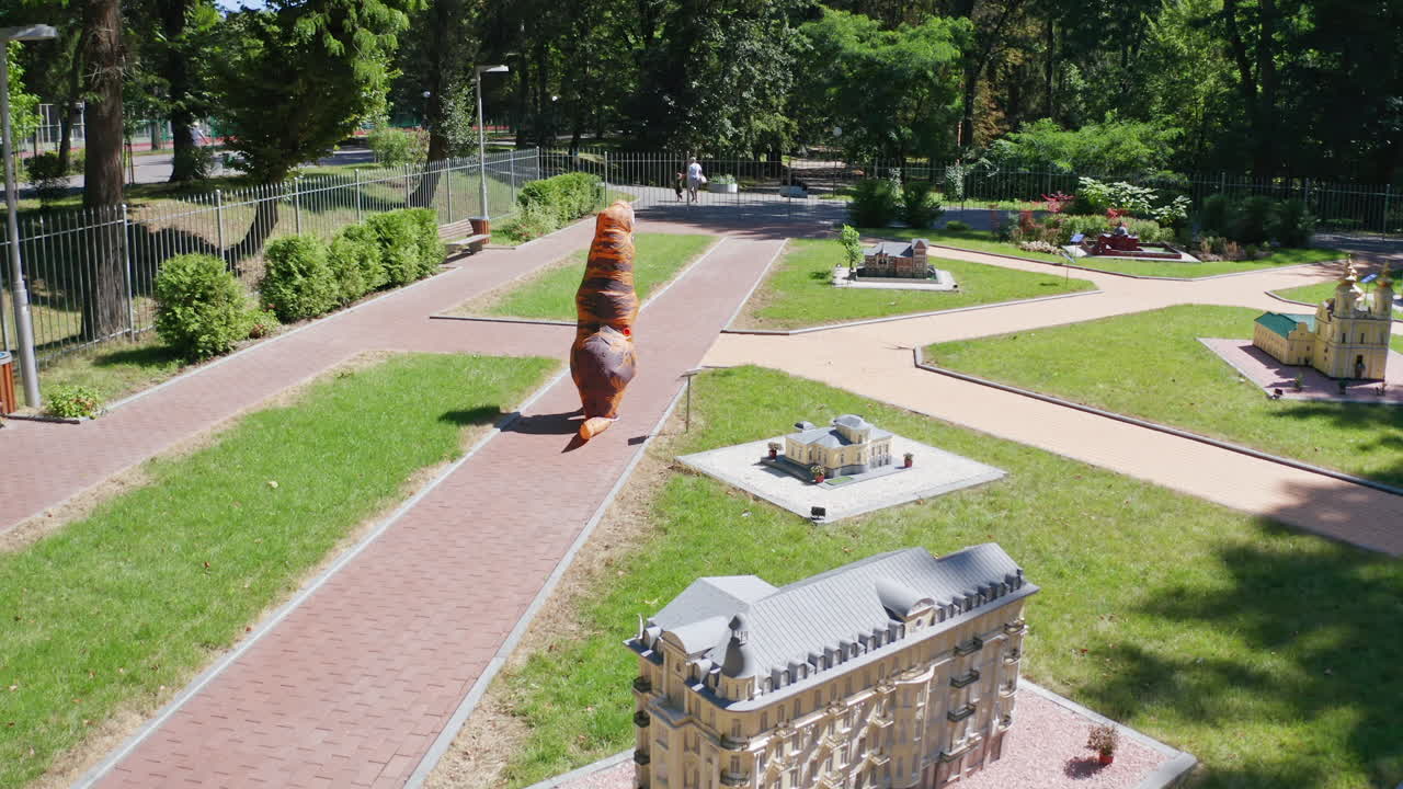 Park with Miniature City and Dinosaur Costume