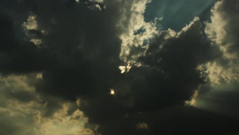 Out-of-focus-time-lapse-shot-of-flowing-dark-clouds-and-deep-silhouette