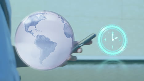 animación del globo y el reloj sobre el hombre de negocios usando el teléfono inteligente.