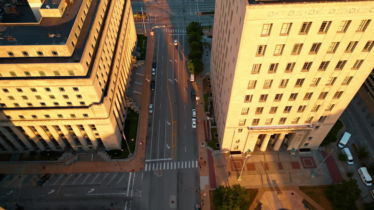 Empty wide-lane streets of Saint-Louis, Missouri, USA. Drone footage near the massive buildings lit with sun