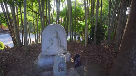 in japanese temples, buddha statues are usually surrounded by an environment of nature and tranquility.