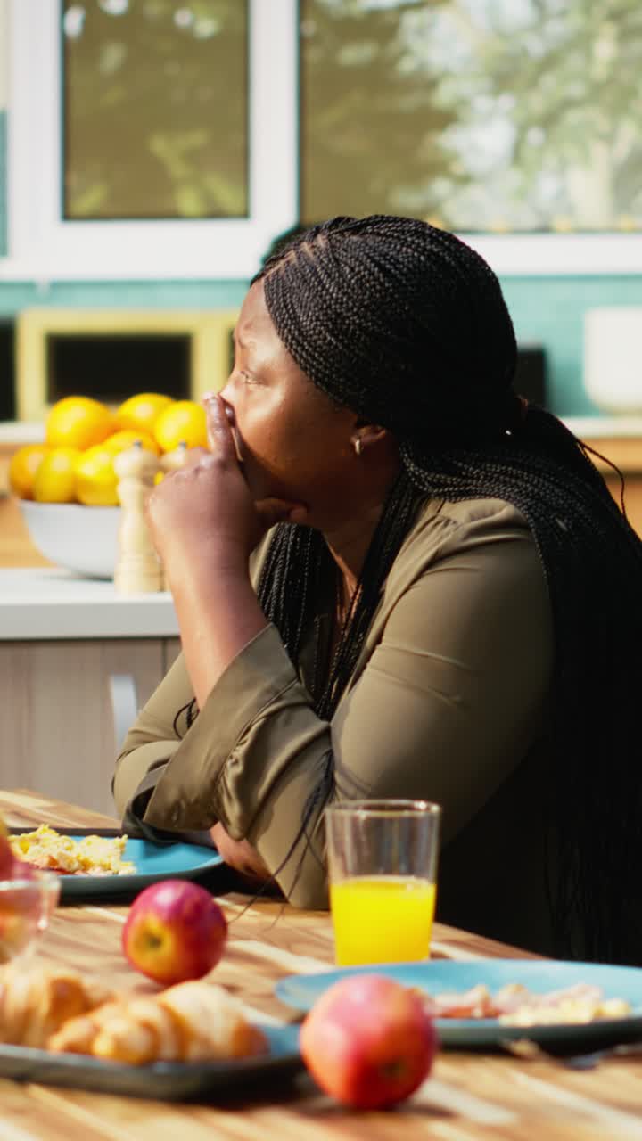 Vertical Video African american mom feeling disconnected and ignoring her children