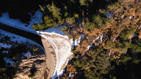 aerial overhead shot over snow capped angeles crest highway