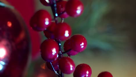 close-up revealing the christmas decoration of plastic red berries