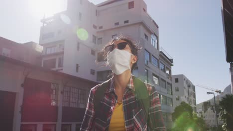 Mixed-race-woman-wearing-medical-coronavirus-mask-on-the-street