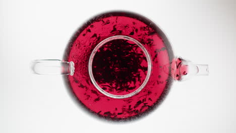 glass teapot with red tea