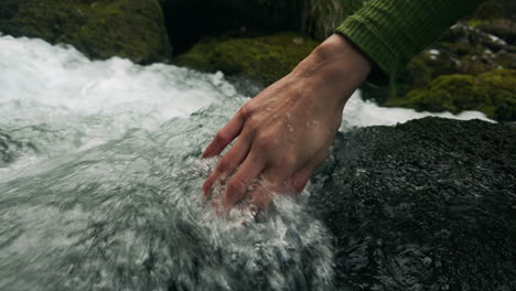 hand in a mountain stream