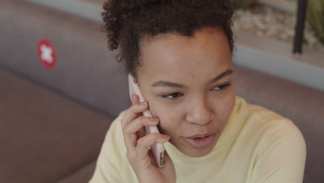 young biracial woman talking on cellphone