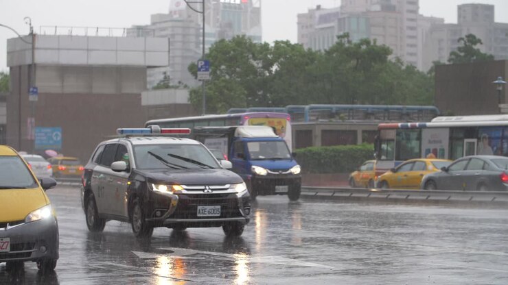 Cars Driving Through Heavy Rain in Taipei