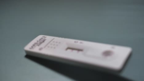 covid rapid antigen test positive result. infection, screening and treatment. slowmotion. scene c