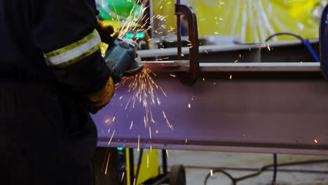 Male-engineer-using-grinder-machine-in-workshop-4k