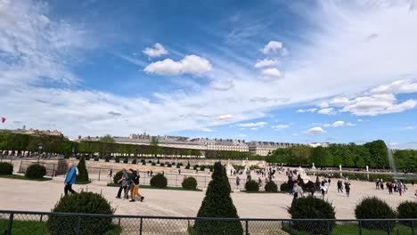 visitors enjoying tuileries garden in paris