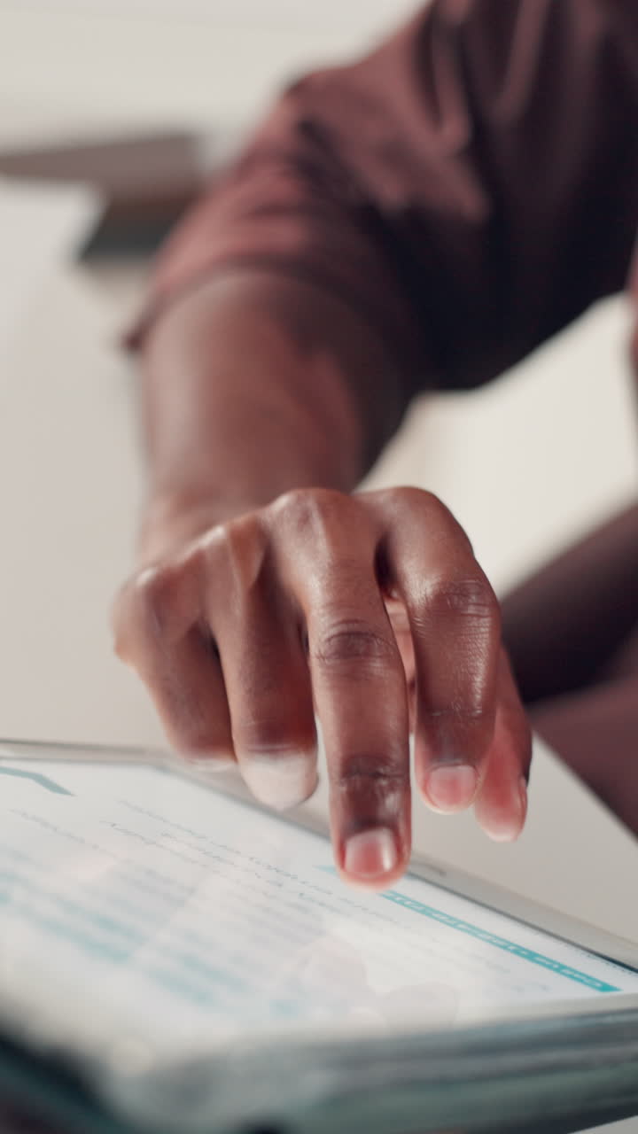 Close-up of a Person's Hand Using a Digital Tablet