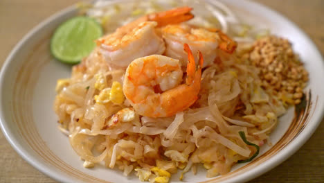 stir-fried noodles with shrimp and sprouts or pad thai - asian food style