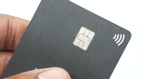 person holding a black credit card