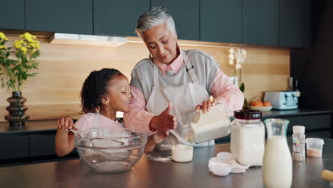 grandmother and granddaughter baking together in the kitchen