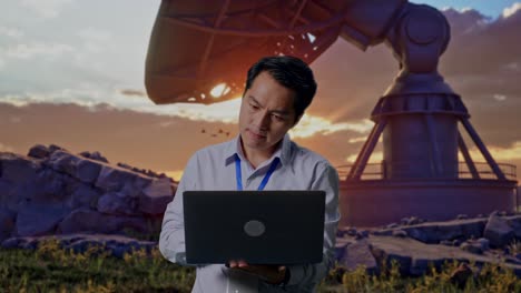 asian male professional worker standing with his laptop with large satellite dish, work continuously