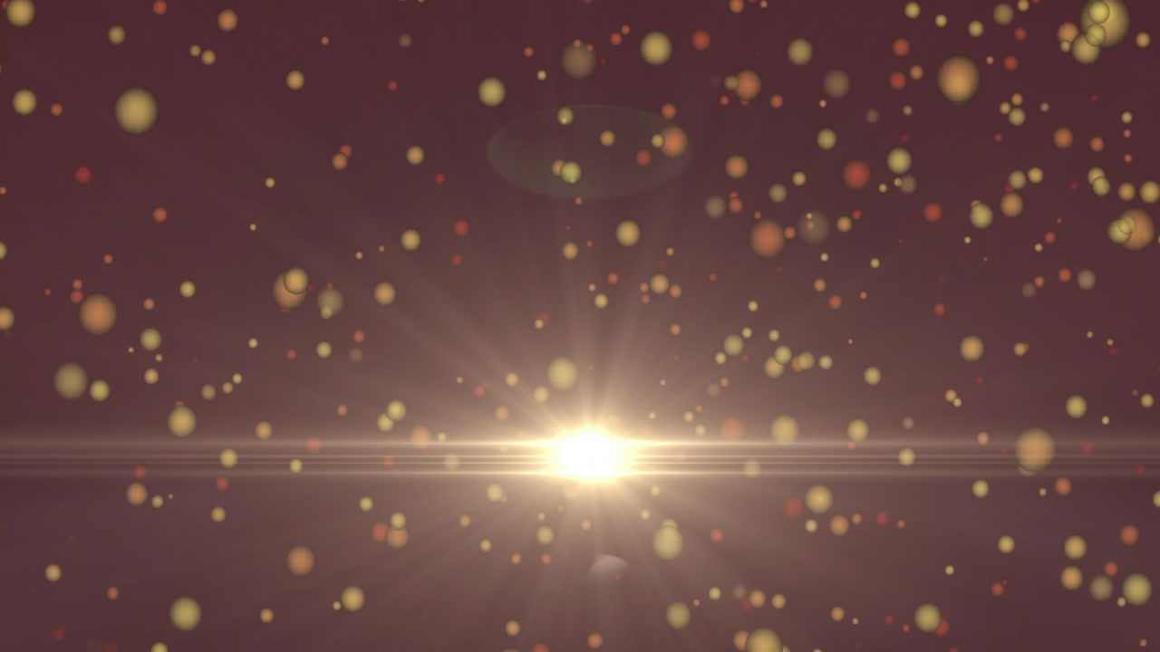 Animation of glowing particles floating over bright light burst on dark background