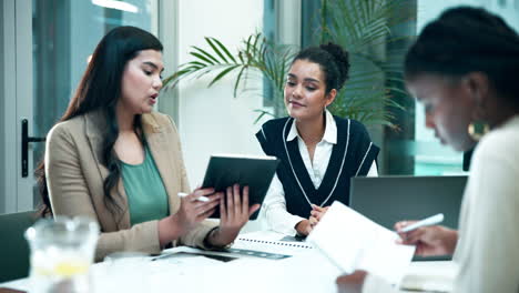 businesswomen collaborating in an office meeting