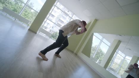 man breakdancing in modern studio