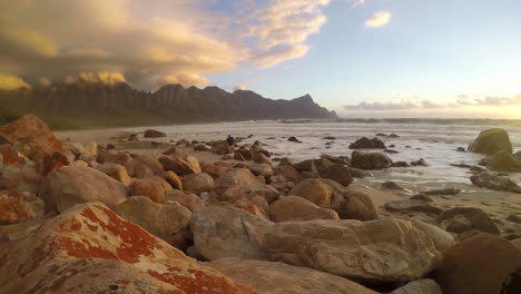 A-short-time-lapse-of-waves-crashing-over-a-rocky-beach-while-photographer-is-taking-pictures