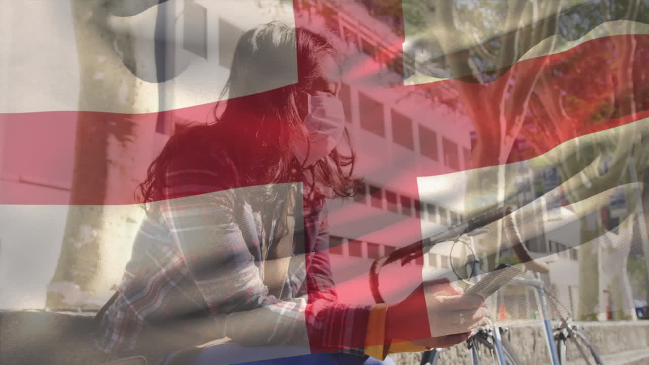 얼굴 마스크를 쓰고 있는 여성 위에 영국 국기의 애니메이션