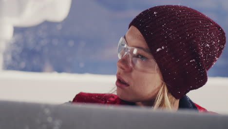woman ice sculpting in winter