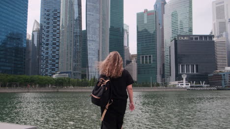 woman walking along marina bay in singapore