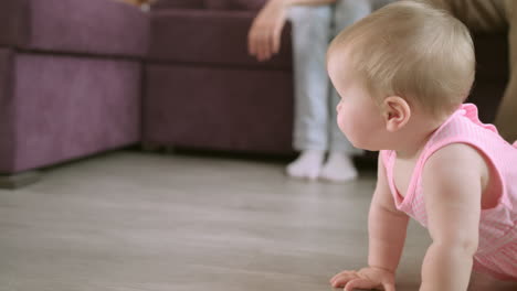 beautiful baby crawling on floor at home. happy family concept