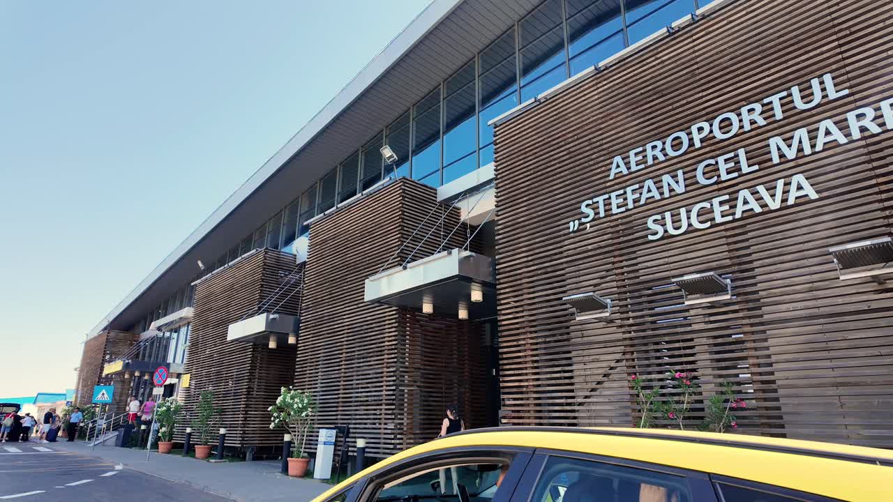 Exterior view of Stefan cel Mare Suceava International Airport with a taxi cab