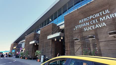 exterior view of stefan cel mare suceava international airport with a taxi cab