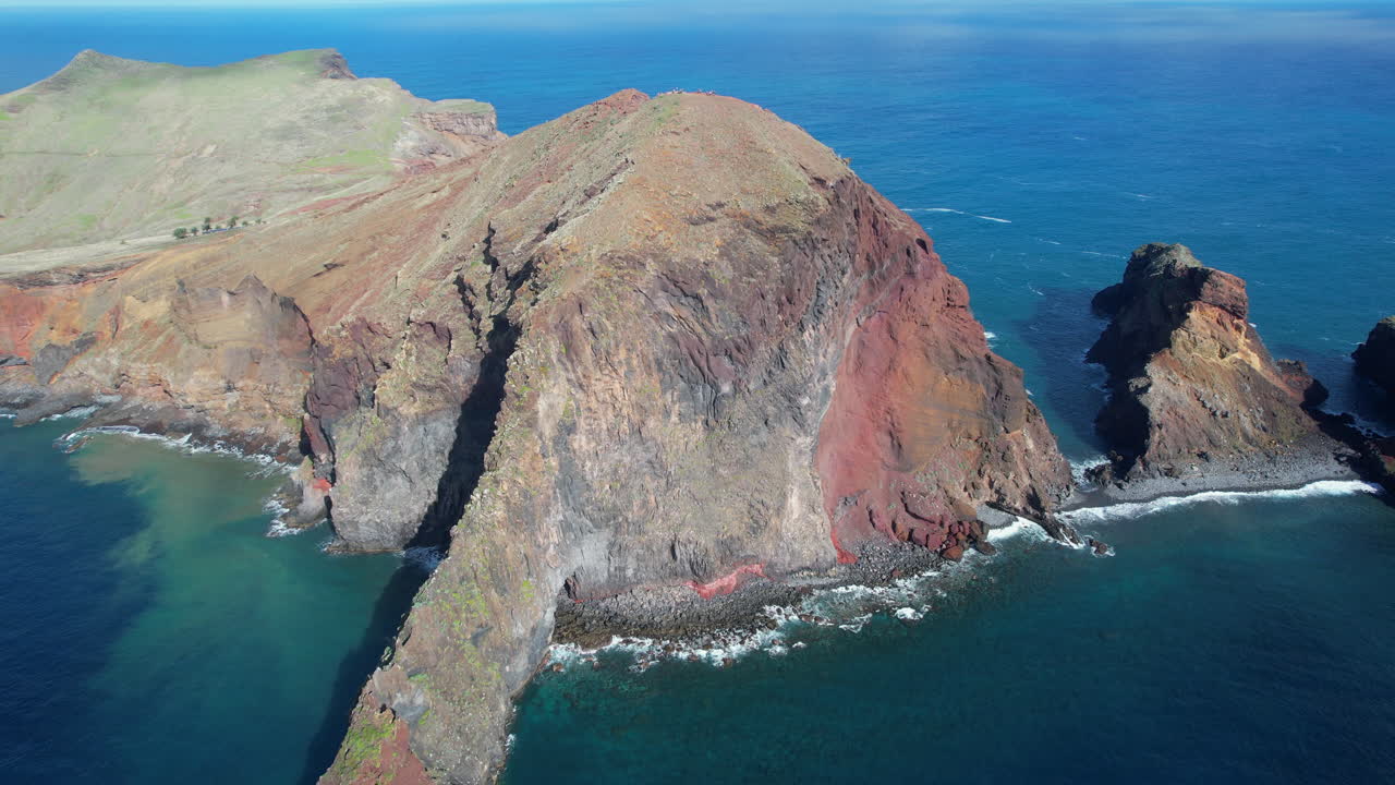 Spectacular aerial perspective of the rugged coastline and volcanic cliffs of Ponta de Sao Lourenco
