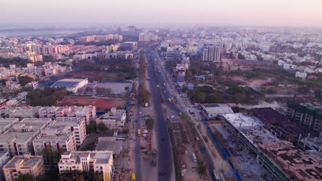 national highway 44 with crowded residential buildings at jeedimetla village, kompally, suchitra, hyderabad, telangana, india. day time, push in, drone shot, 4k.