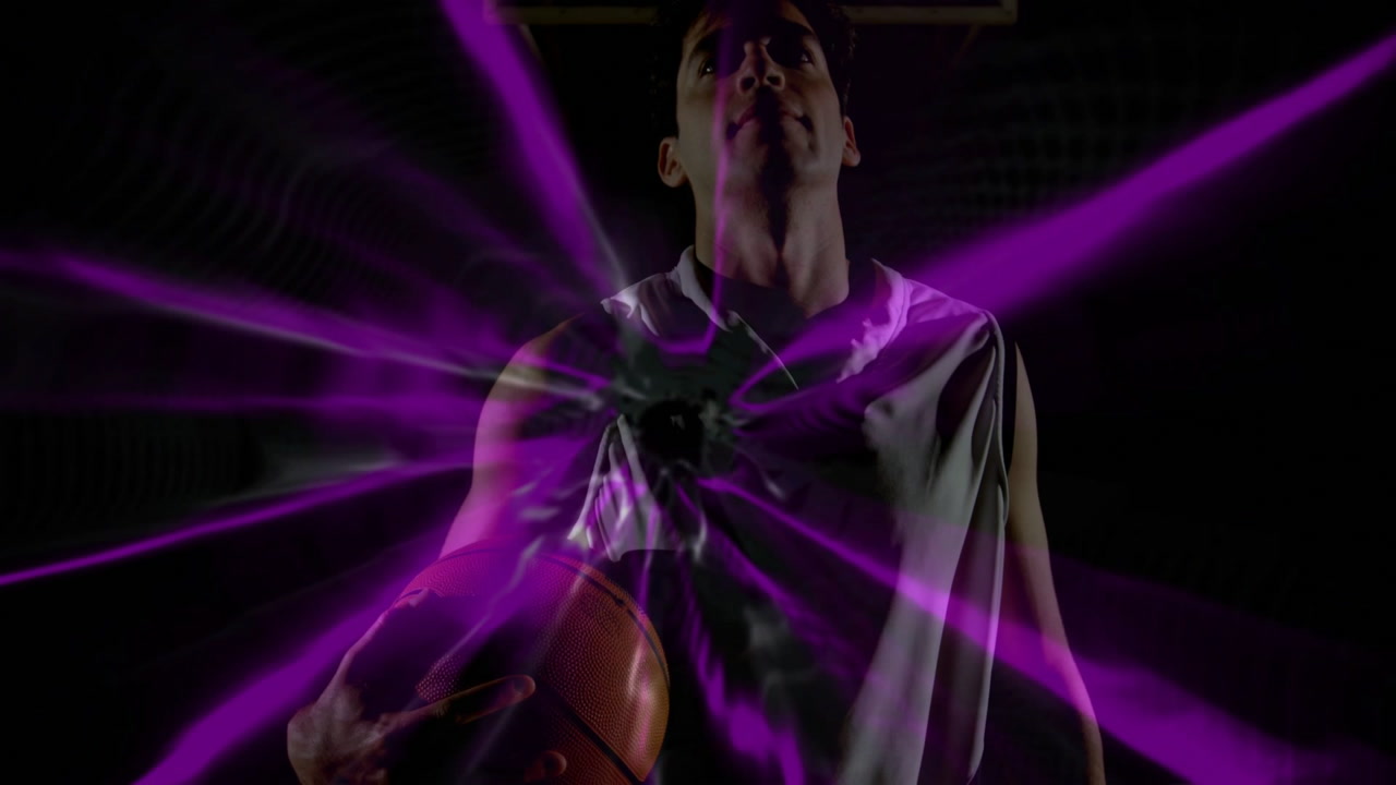 Vertical video: Man dribbling triggers radial lights, camera rising as he lifts basketball for shot