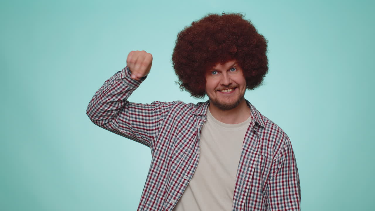 Man pointing down, saying to subscribe, gesturing ok and like, showing place for commercial info