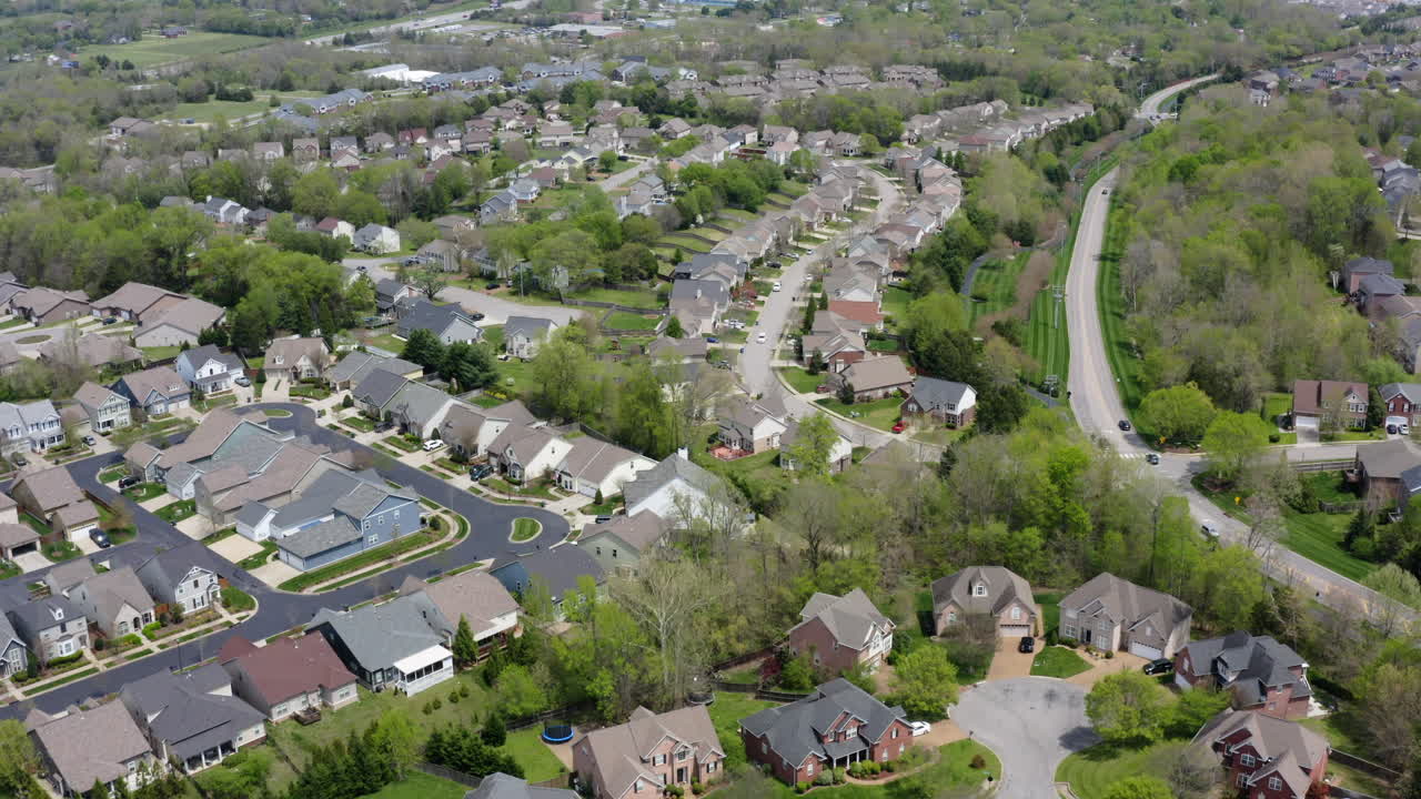 Drone view of cozy Mt. Juliet suburb—winding streets, family homes, and backyard vibes. A slice of small-town charm wrapped in trees and Tennessee sunshine
