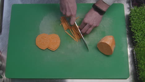 chef preparing sliced sweet potato