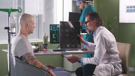 doctor discussing brain scan results with patient