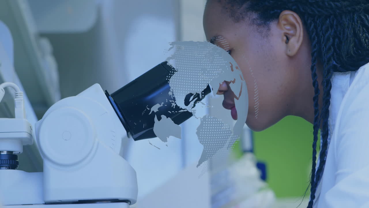Female scientist leaning in examining sample in lab, showing floating digital globe graphic