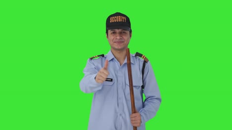 Happy-Indian-security-guard-showing-thumbs-up-Green-screen