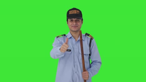 happy indian security guard showing thumbs up green screen