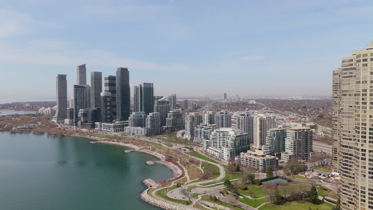 Restaurants And Towering Condominium Buildings Near Parklawn Neighbourhood In Etobicoke, Toronto, Ontario, Canada. Aerial Drone Shot