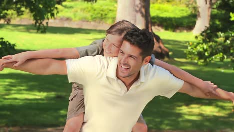 Young-boy-playing-with-his-father