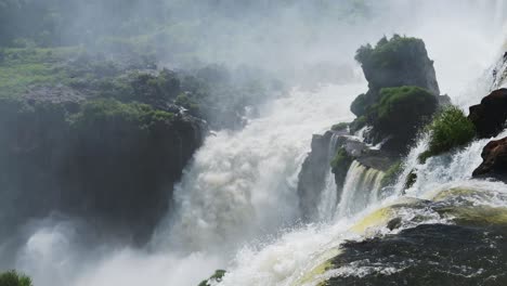 Amazing-Colourful-Landscape-of-Beautiful-Bright-Watervall-Valleys,-Large-Stretch-of-Long-Waterfalls-in-Blue-Sunny-Weather-Conditions,-Rocky-Landscapes-in-Iguazu-Falls,-Brazil,-South-America