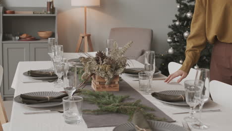 decorator adding finishing touches to festive table